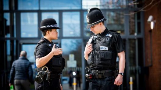 Police Officers with Sepura Radios on Patrol LR