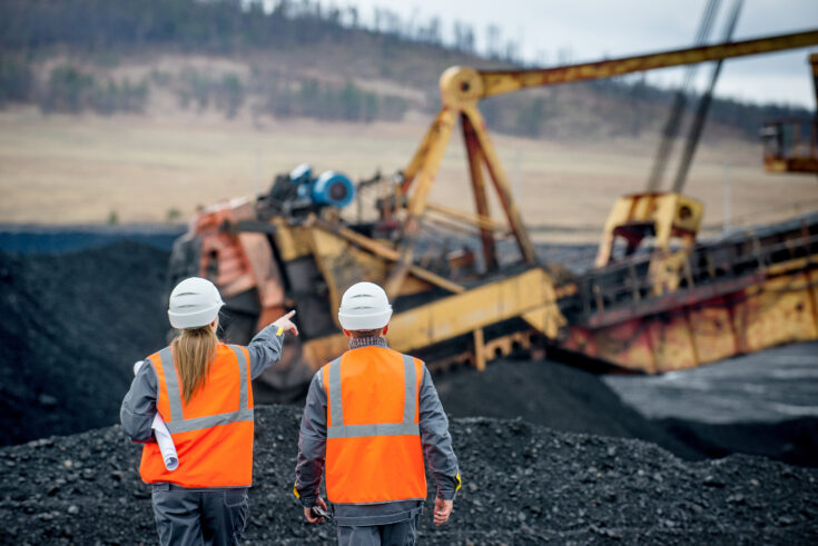 Coal mine workers in an open pit shutterstock 646064452