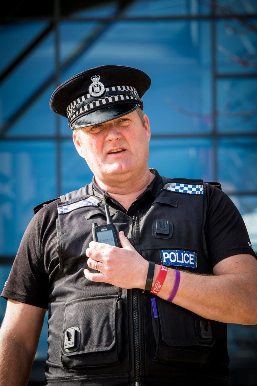 Police Officers Using Sepura TETRA Radios LR